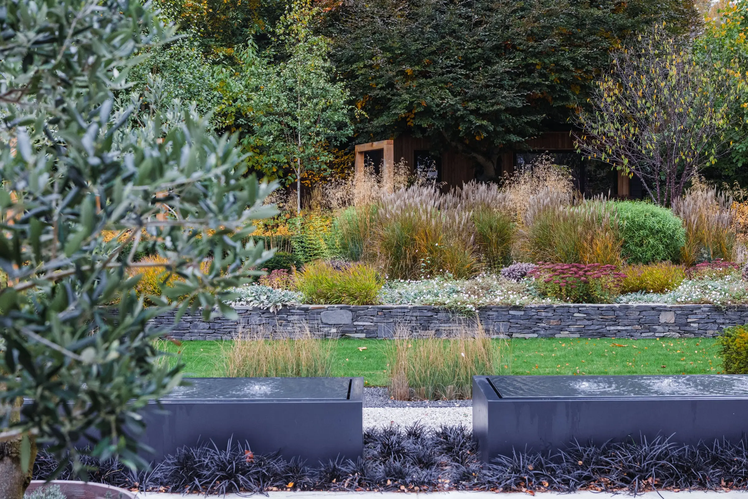 Layered grasses and perennials in a Woburn Sands garden
