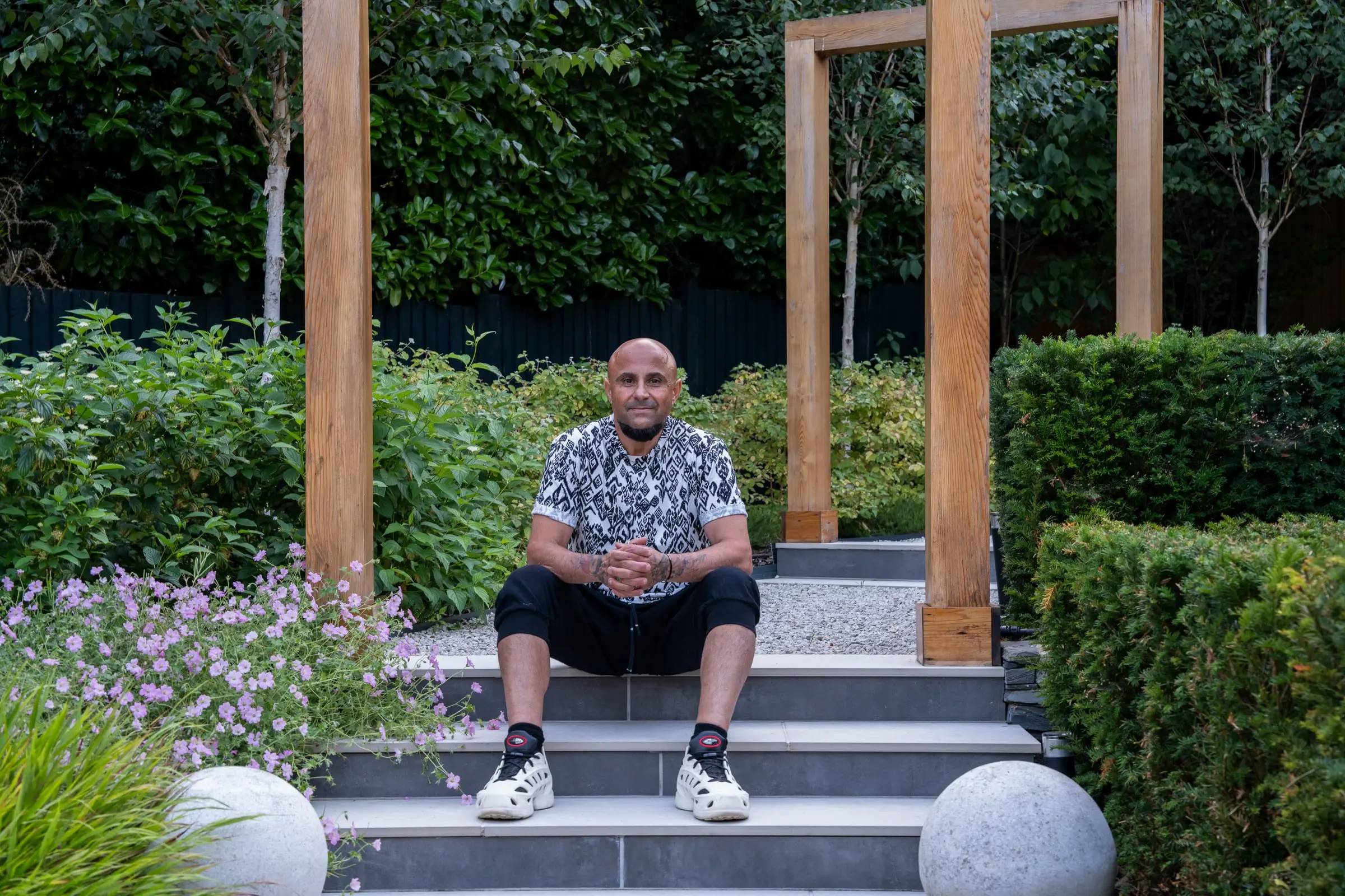 Stathis Lazarides, founder of Epoch Garden Design, in a completed garden